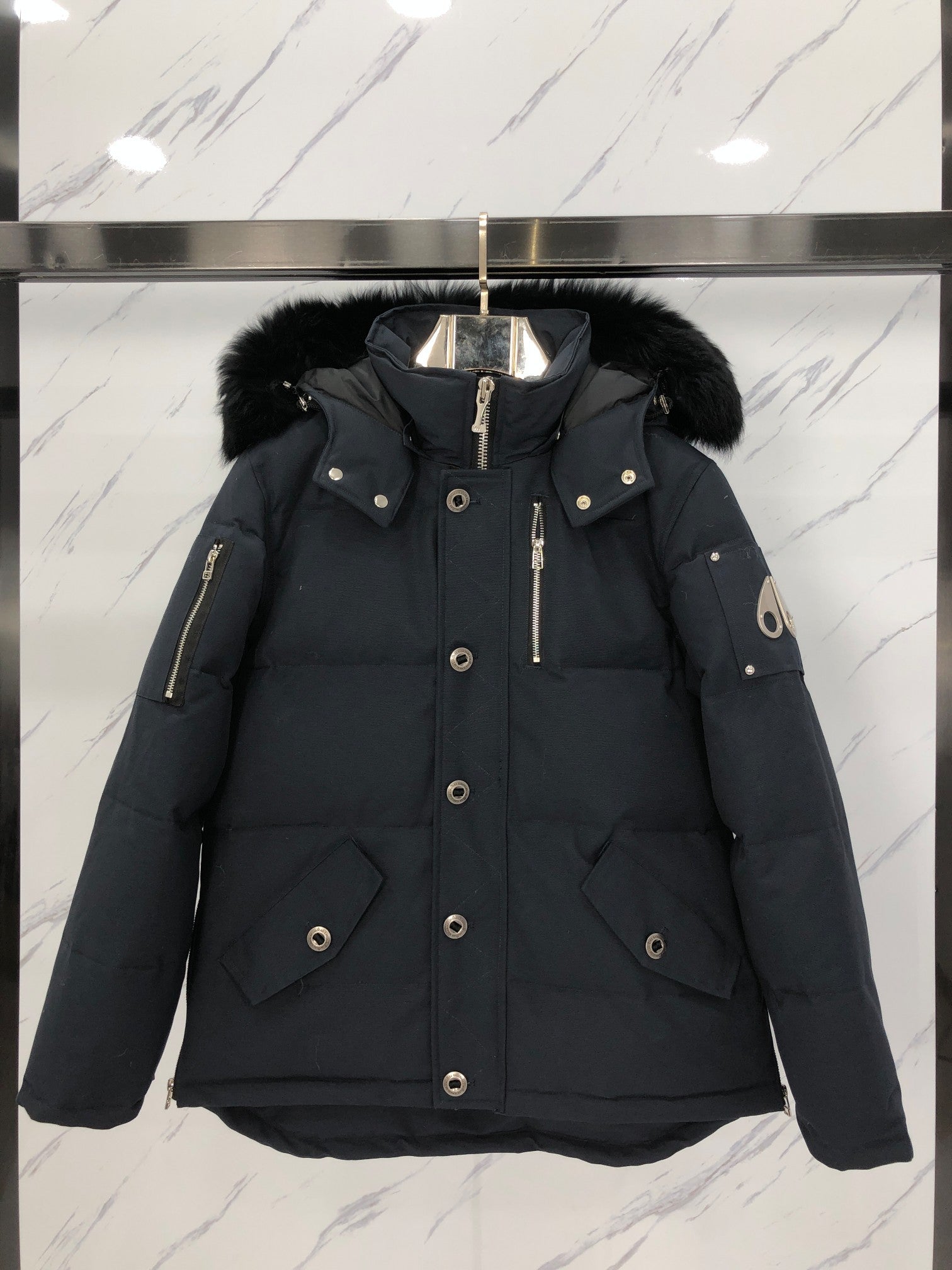 ** Moose Knuckles Men's Down Jacket - High-Performance Winter Wear

**