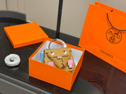 HermÃ¨s Kelly Doll Picto Mosaic - Biscuit & Mallow Purple Leather, 18cm