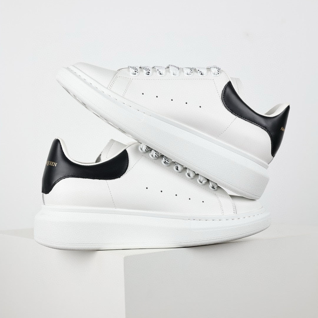 ** Alexander McQueen White Calfskin Sneakers - Authentic Lace-Up Sneakers

**