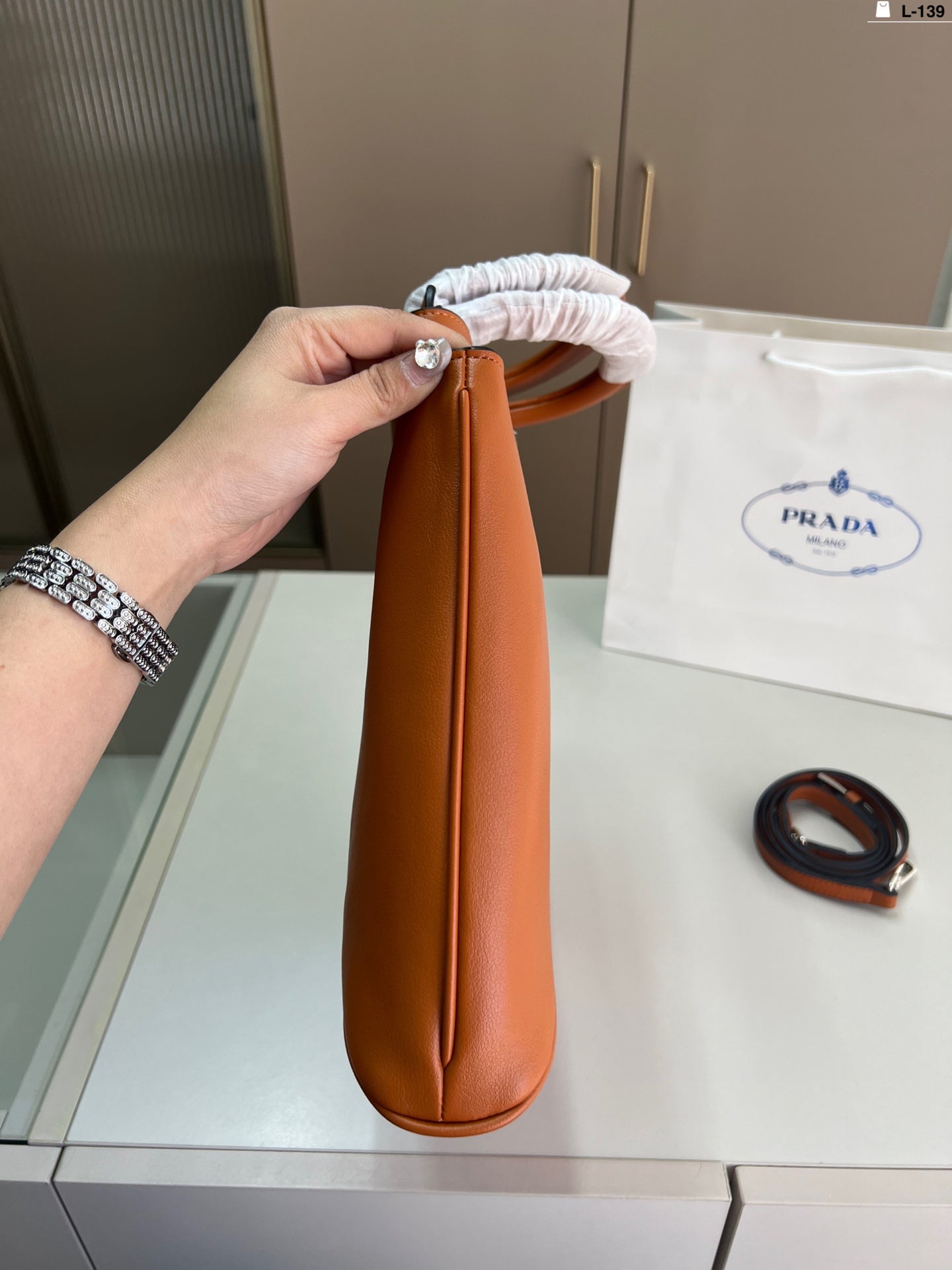 Elegant Prada Buckle Handbag - Versatile Luxury Design