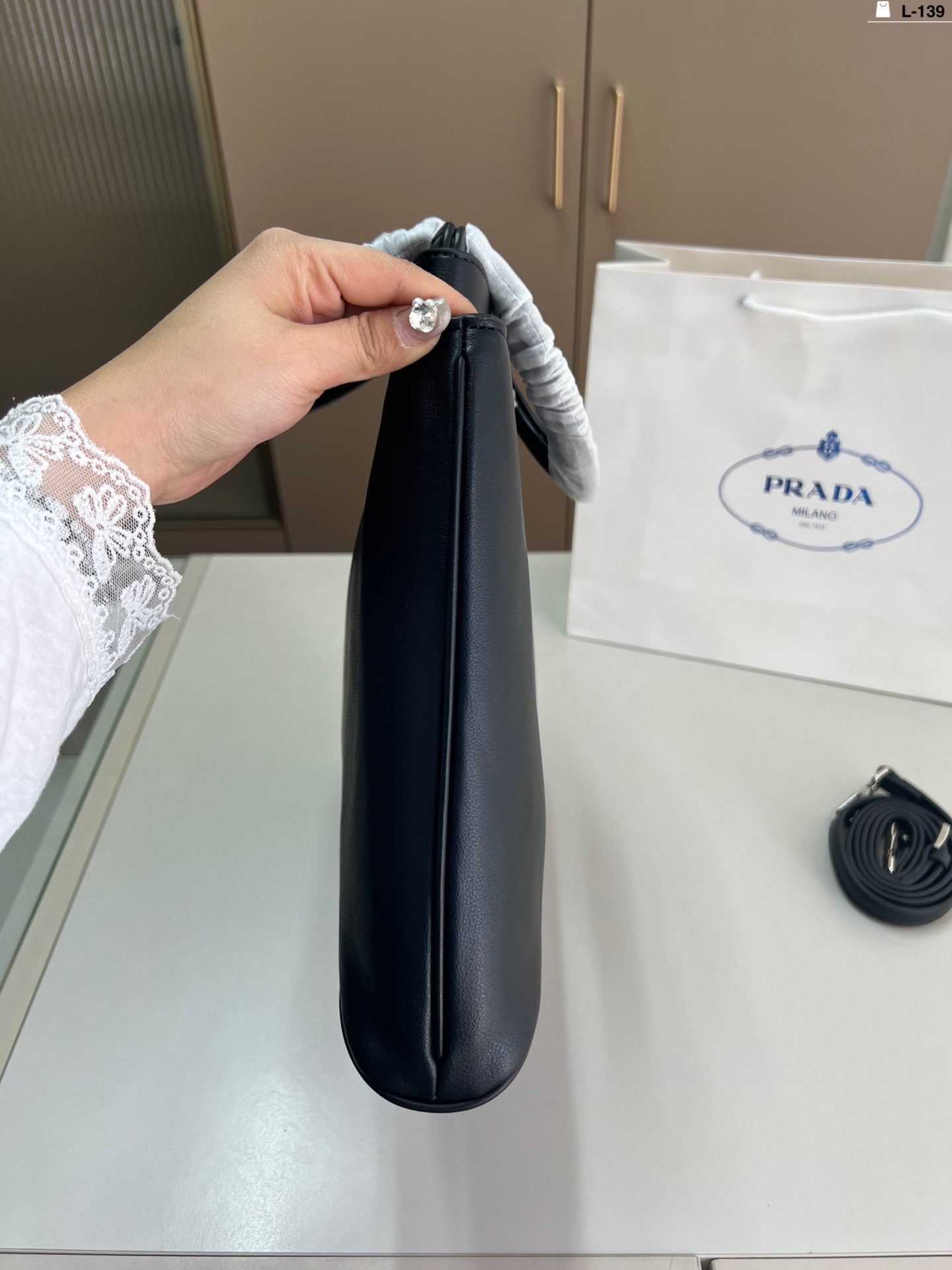 Elegant Prada Buckle Handbag - Versatile & Chic