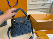 Louis Vuitton Denim Capucines Handbag - Luxurious Elegance