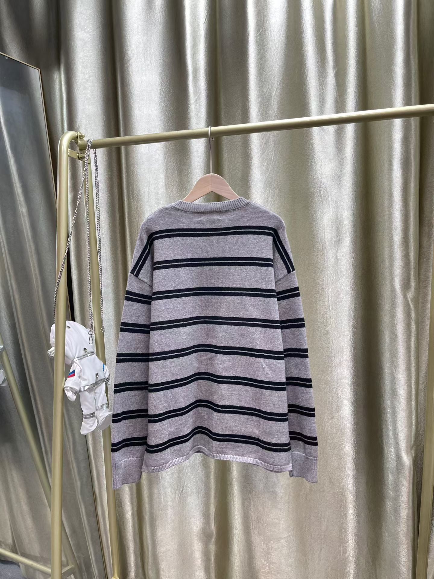 ** Miu Miu Striped Cardigan Sweater with Embroidered Logo

**
