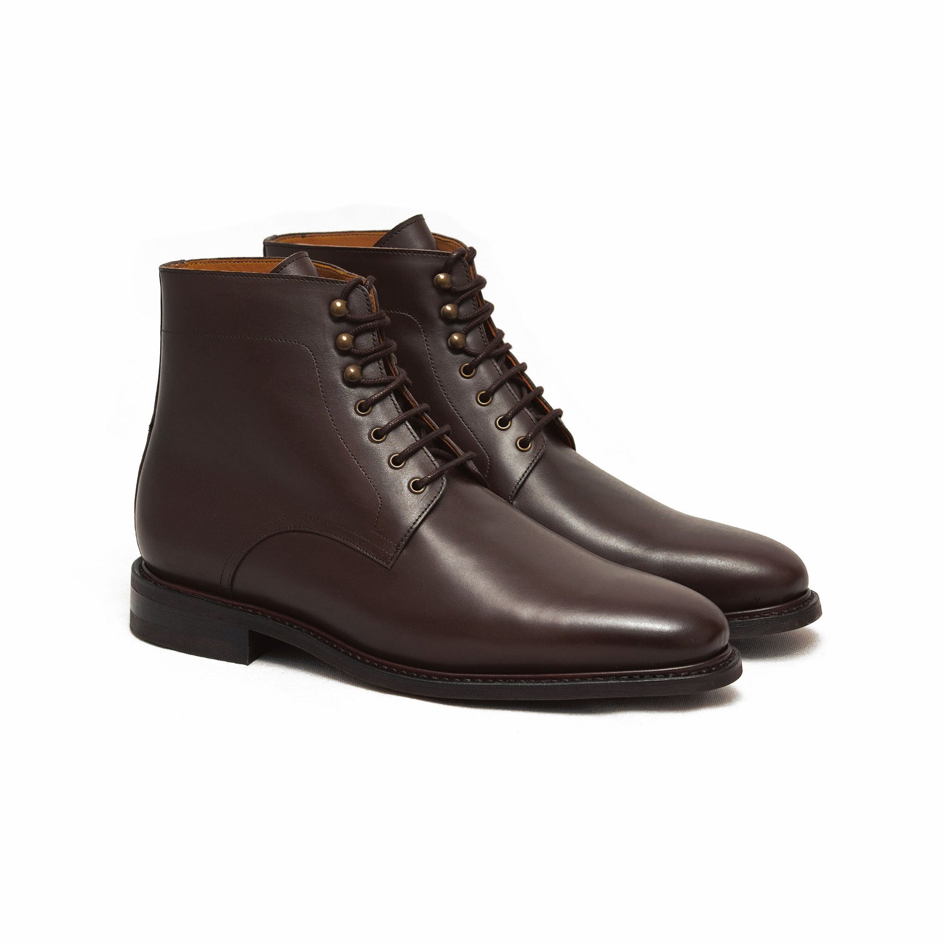 Men brown leather boots crafted using goodyear welt construction 
