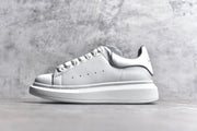 Authentic Alexander McQueen White Lace-Up Sneakers with Anti-Counterfeit Technology
